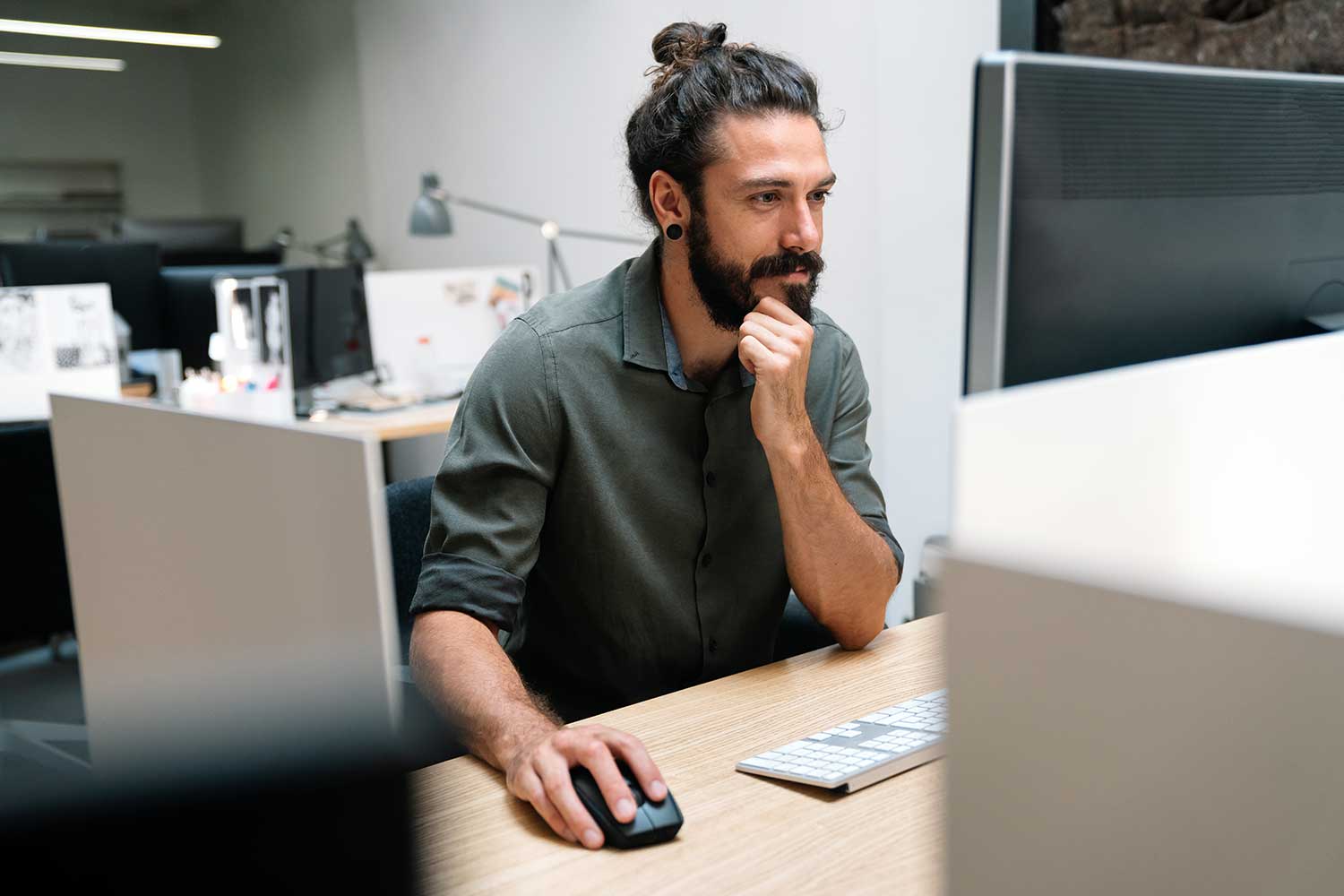 Programmer working on a desktop computer